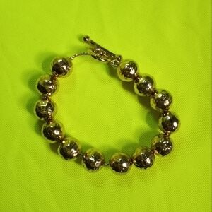 Goldtone hammered beads chain toggle bracelet